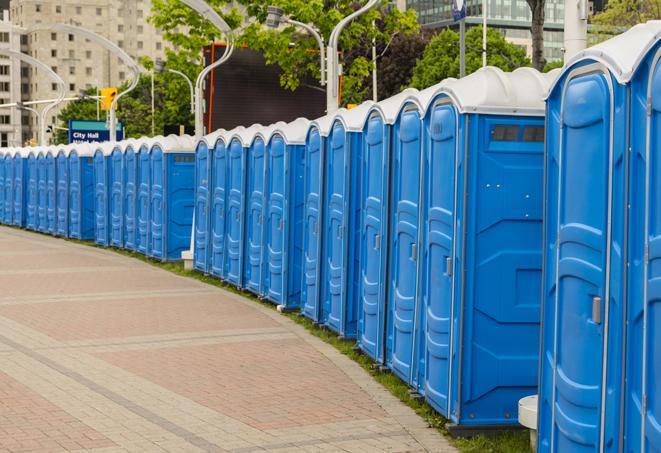 a row of portable restrooms set up for a large athletic event, allowing participants and spectators to easily take care of their needs in Bolingbrook, IL